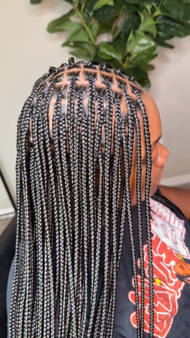 Long dark curly braids by Always Braided